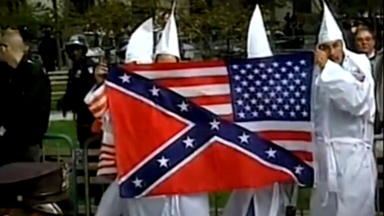 Hate group numbers dipped because their beliefs became mainstream, new report warns
